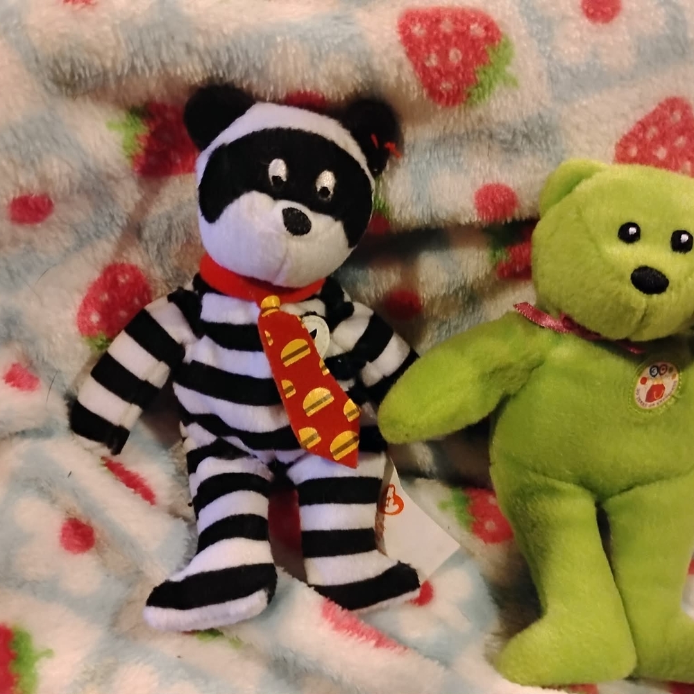 Striped Black and White Stuffed Animal with Red Scarf